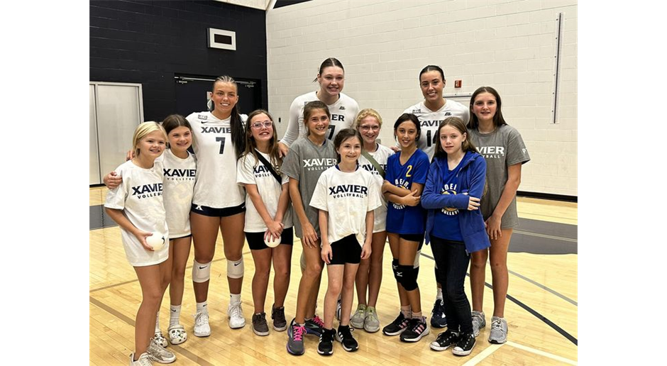 XU players after their game with our 5th grade Athletic team!